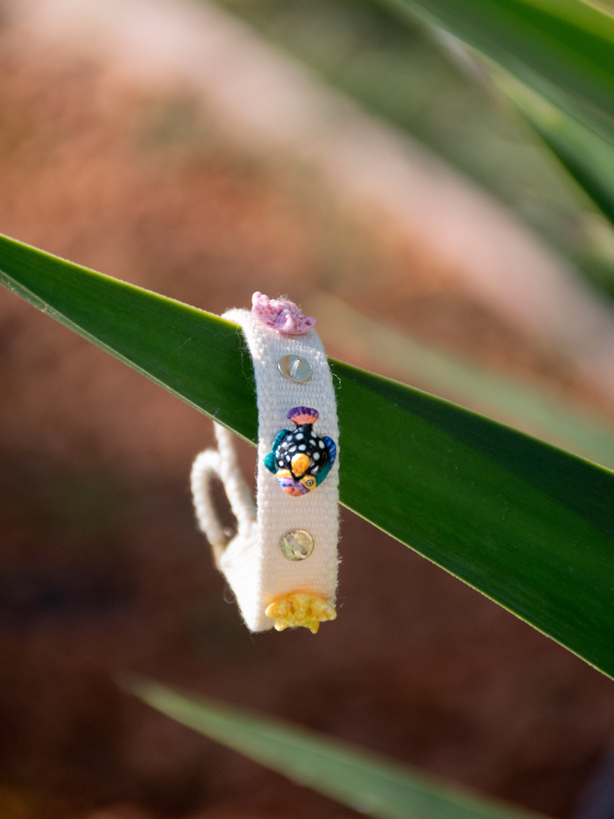 Beige braided charm bracelet