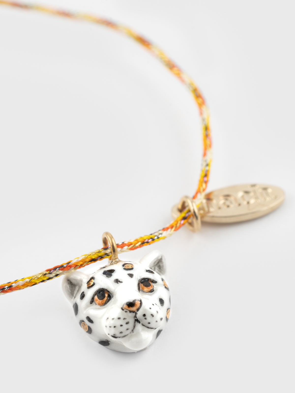 Bracelet cordon léopard blanc et doré