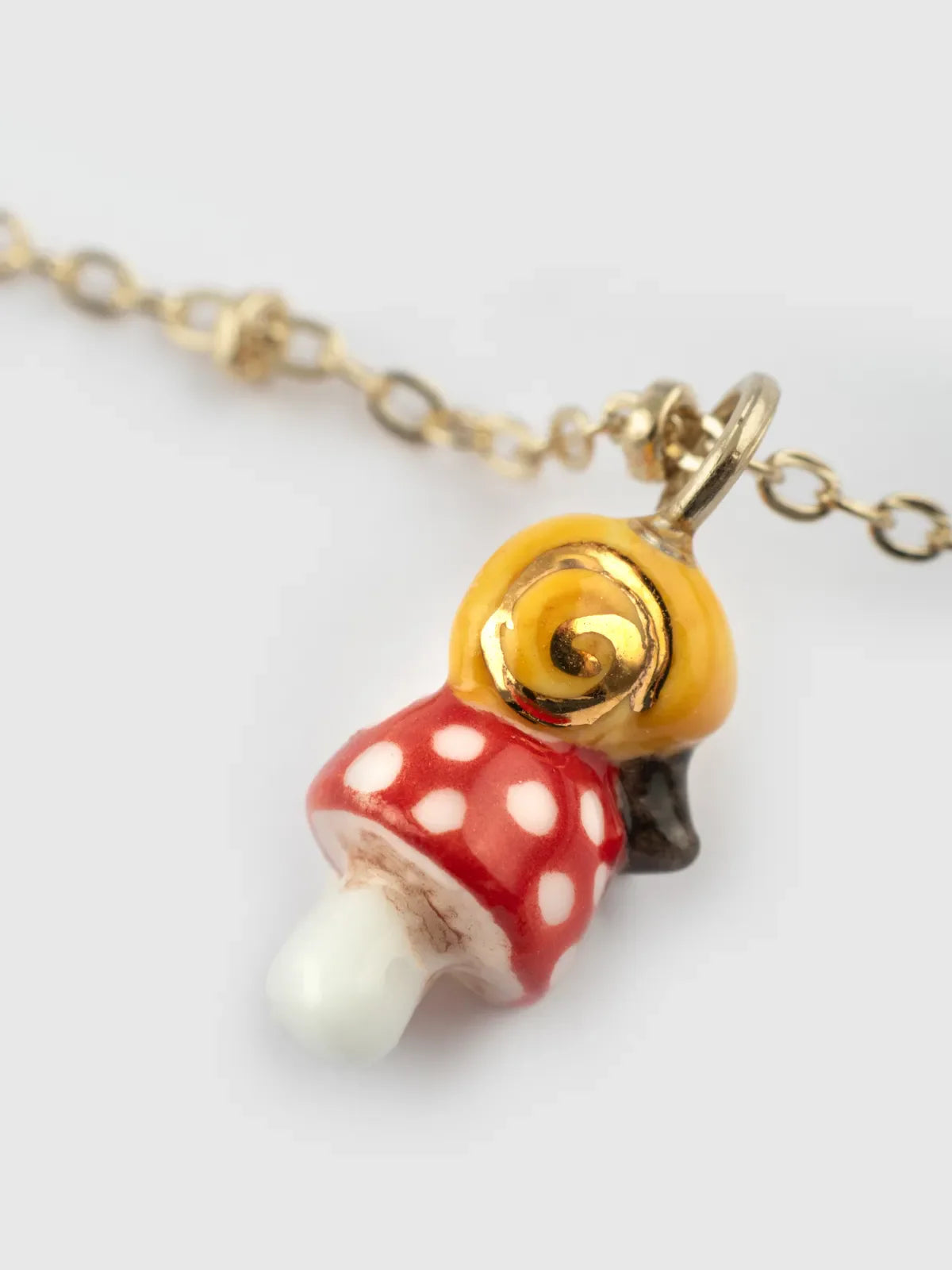 Snail and mushroom necklace