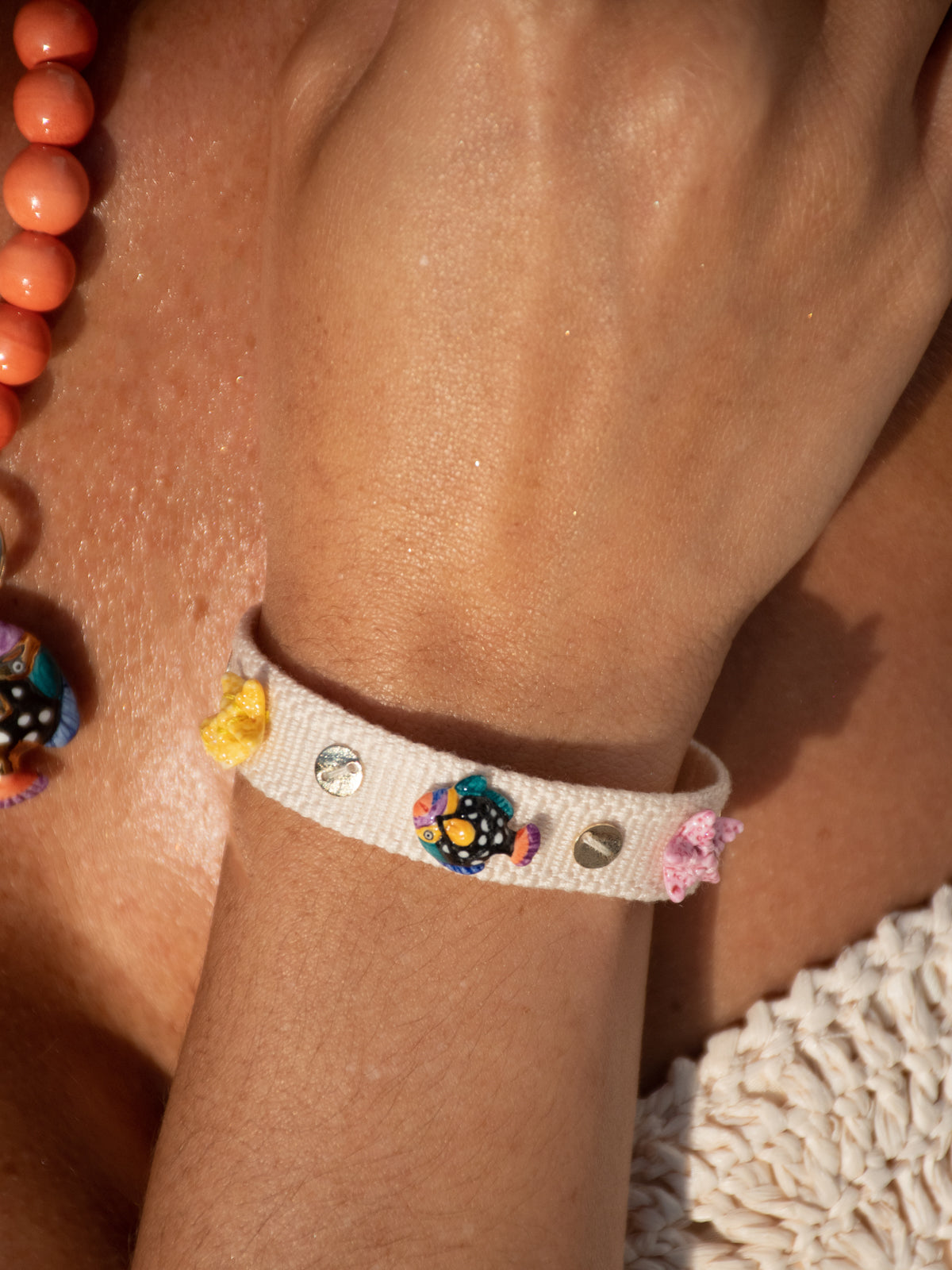 Beige braided charm bracelet