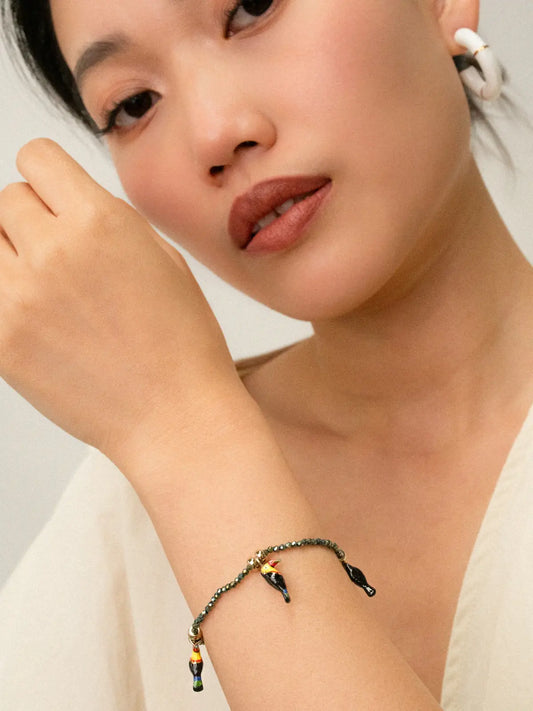 braccialetto con perline di ematite e tucano