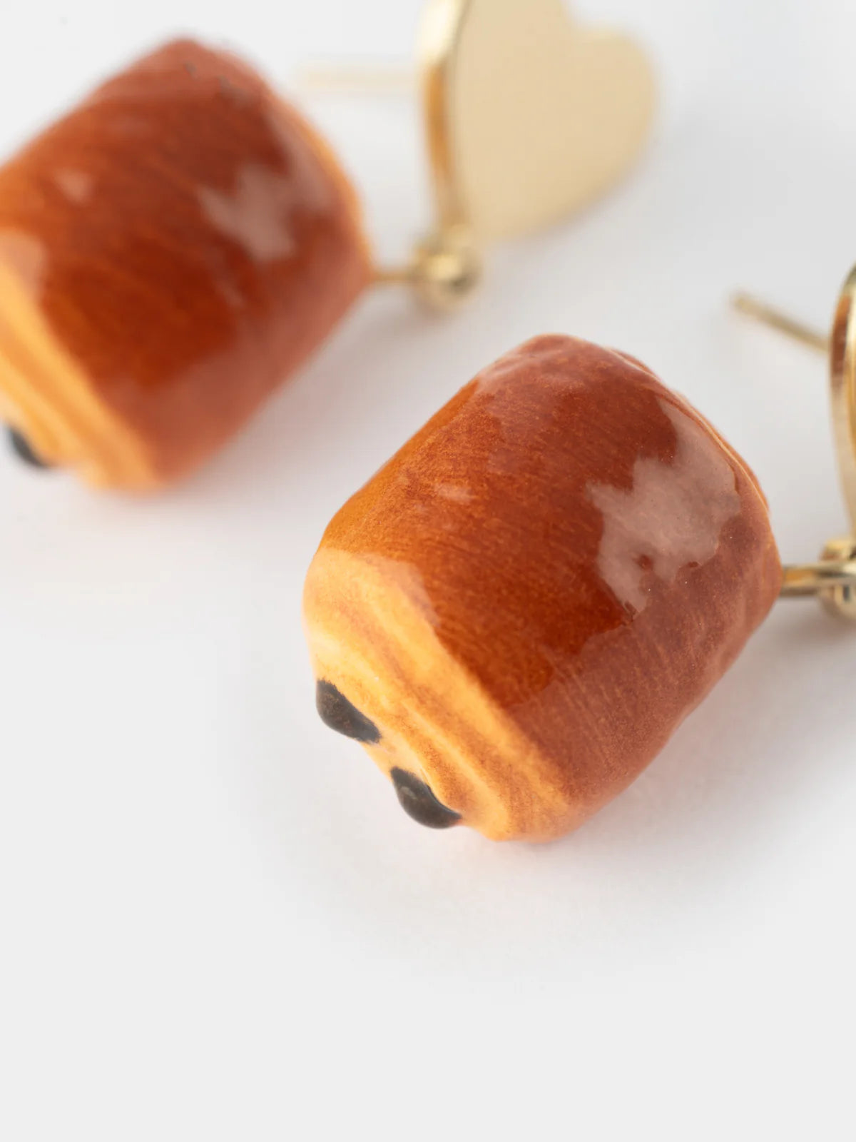 Heart and chocolate croissant ear studs