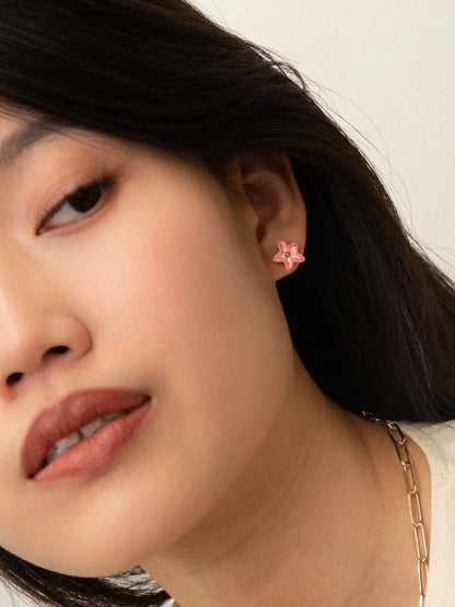 Pink fleur-de-lis ear studs