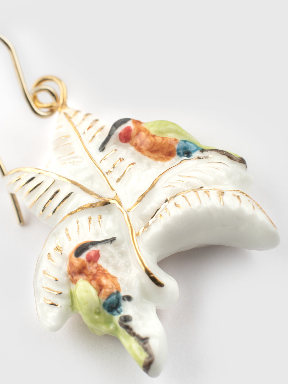 Boucles d'oreilles guêpiers d'Afrique sur palmiers blancs