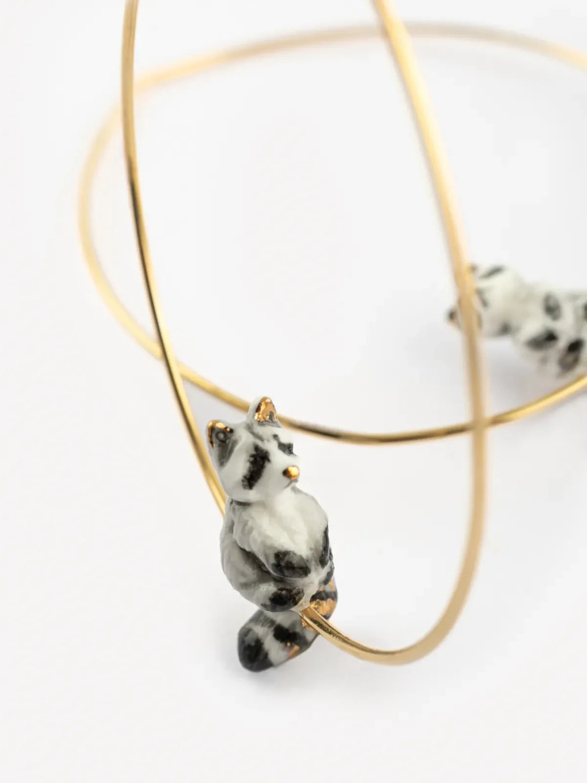 Grandi orecchini creoli a forma di procione