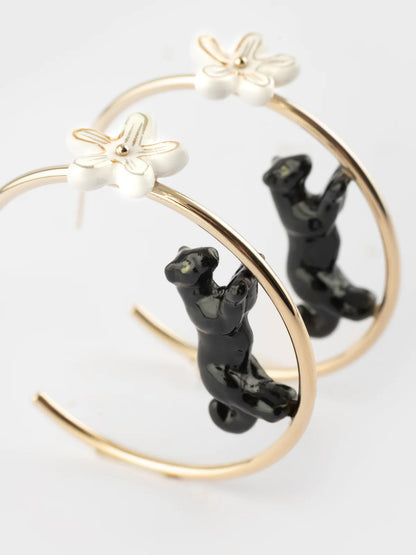 Round hoop earrings with panther and flower print