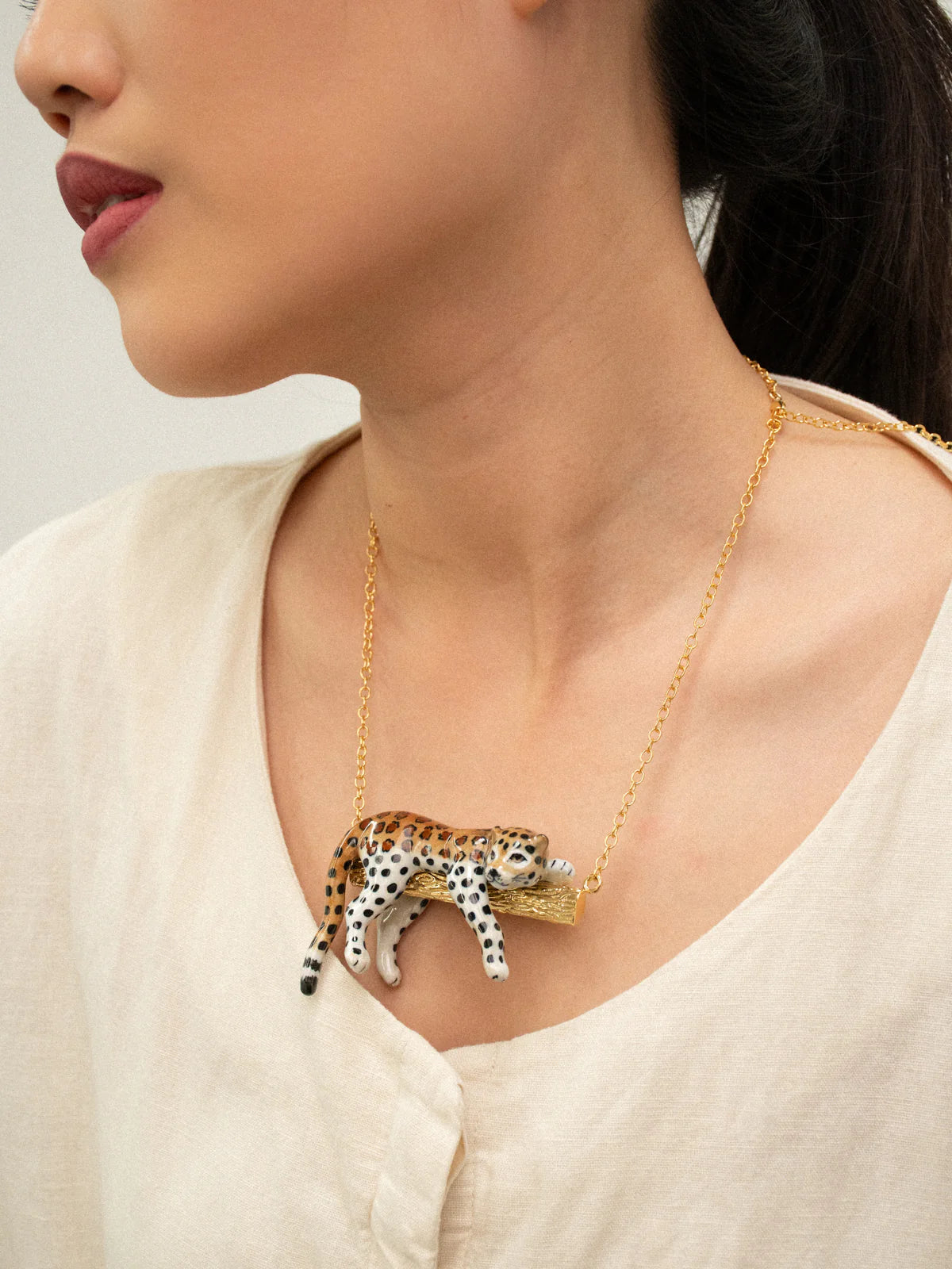Leopard necklace on a branch