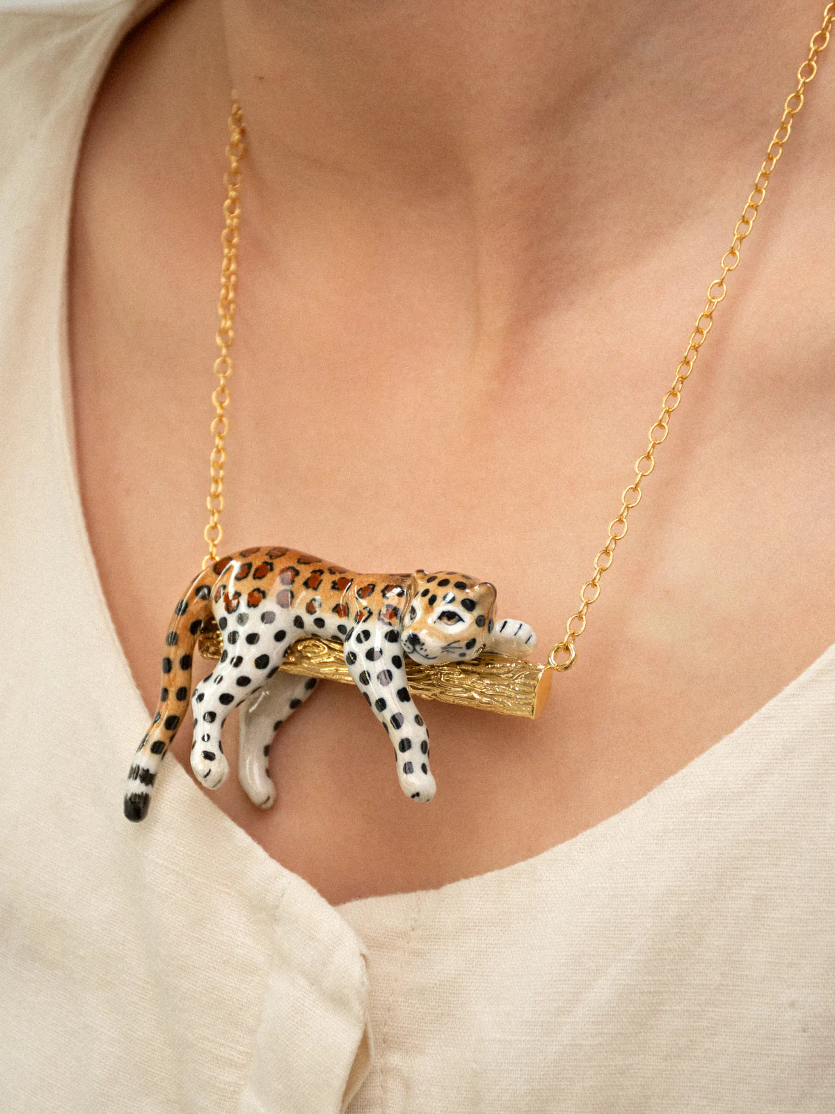 Leopard necklace on a branch